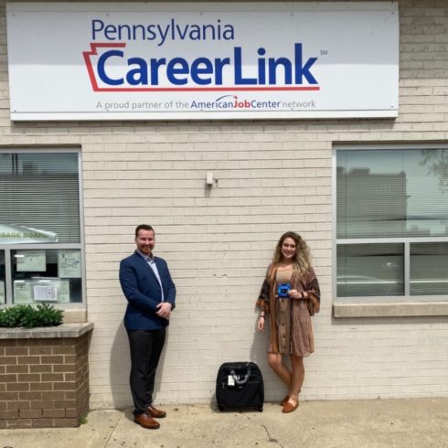 Man and woman standing in front of PA CareerLink office